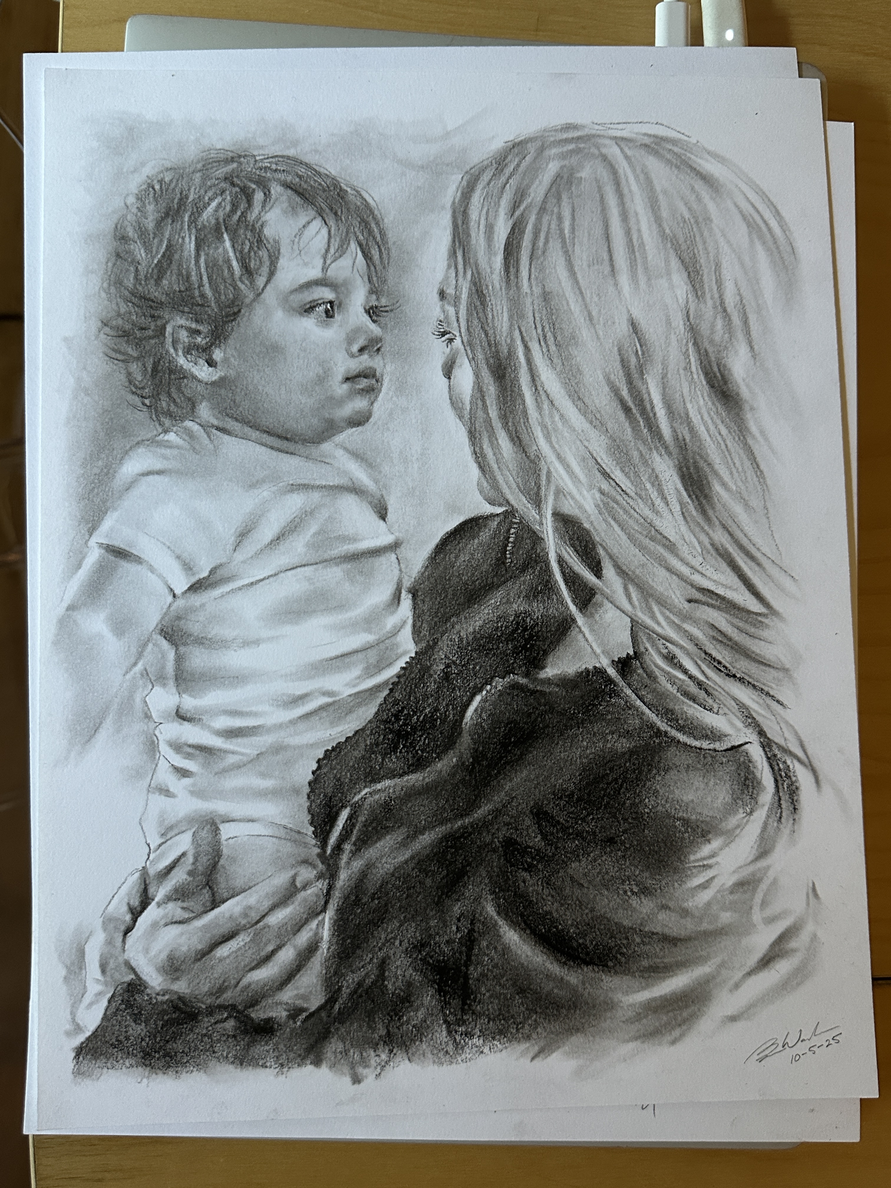 Charcoal drawing of a mother holding her child, expressive figure study by Seattle artist Ben Woodman